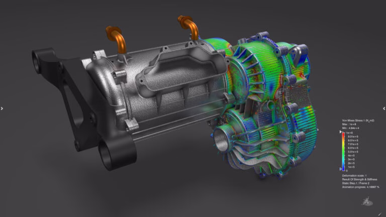 Abaqus R2026x structural simulation showing Von Mises stress contour on an electric drive unit.
