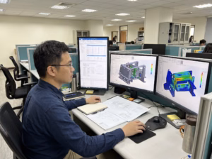 Multi-body contact FEA simulation and stress analysis being evaluated by a structural engineer using advanced 3D CAE software to resolve complex assembly behavior.